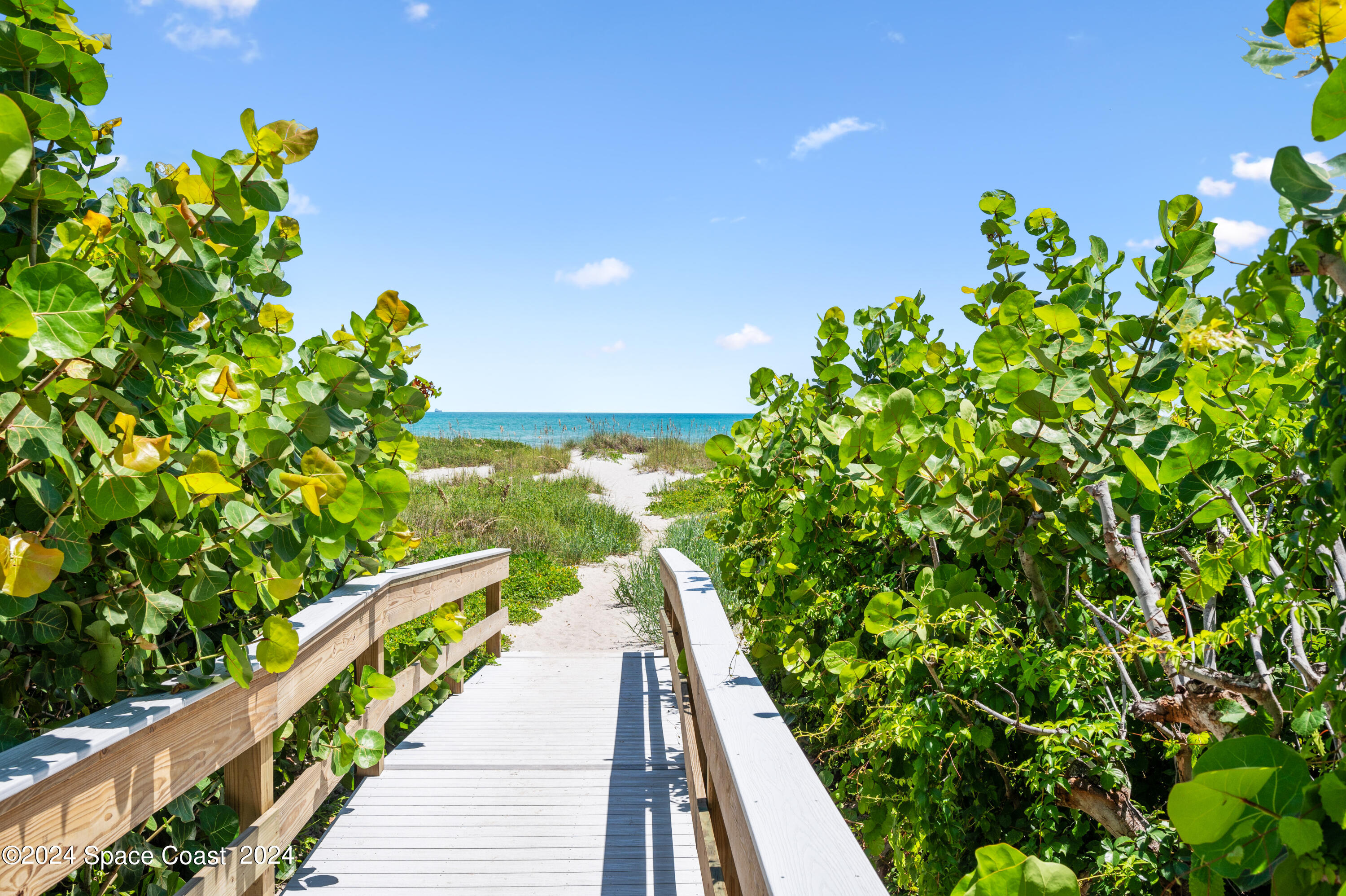 750 North Atlantic Avenue, Unit 608 Cocoa Beach, FL 32931 - Photo 4 of 39 a view of a balcony with a flower garden