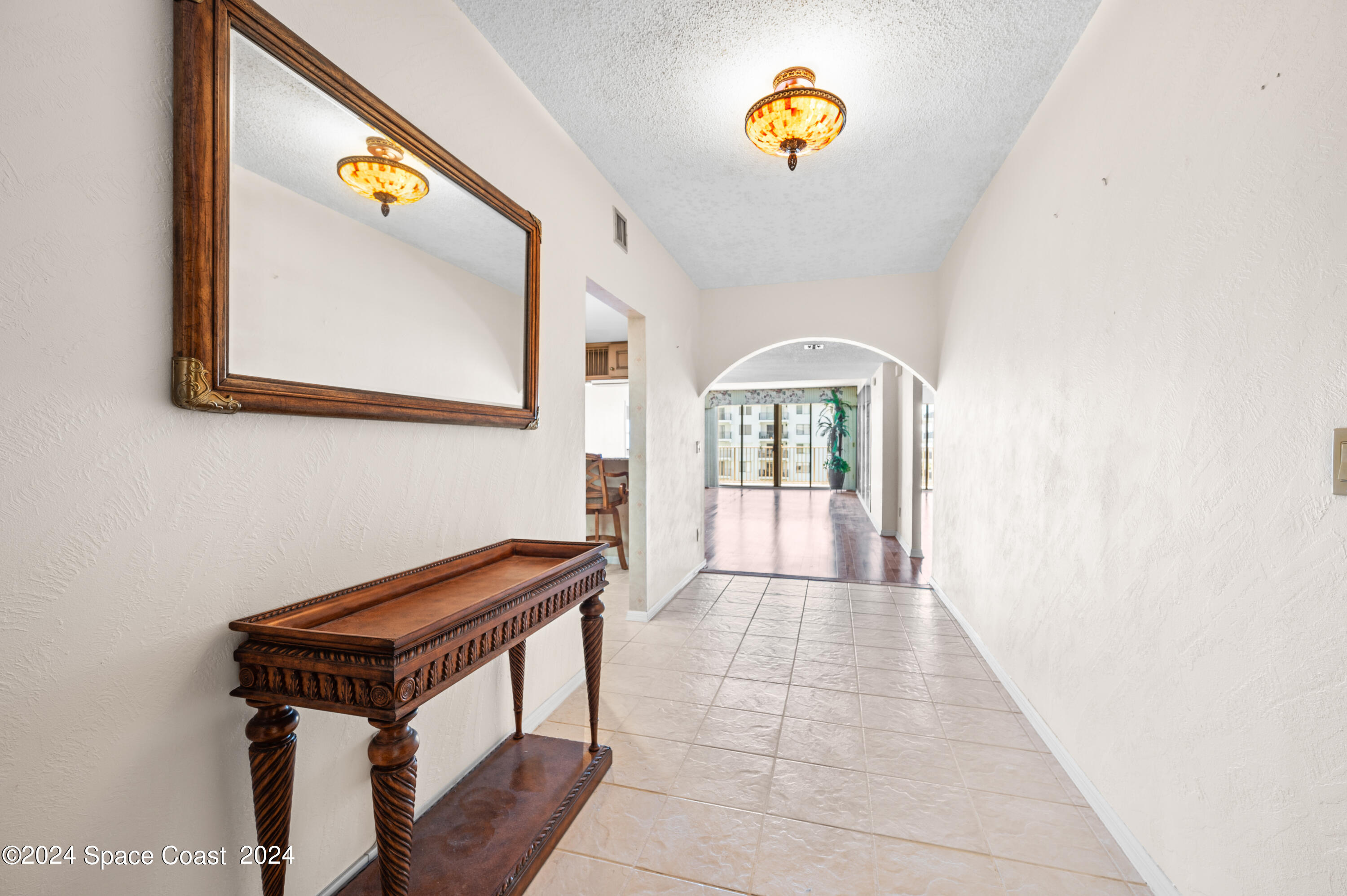 750 North Atlantic Avenue, Unit 608 Cocoa Beach, FL 32931 - Photo 5 of 39 a view of an entryway with wooden floor