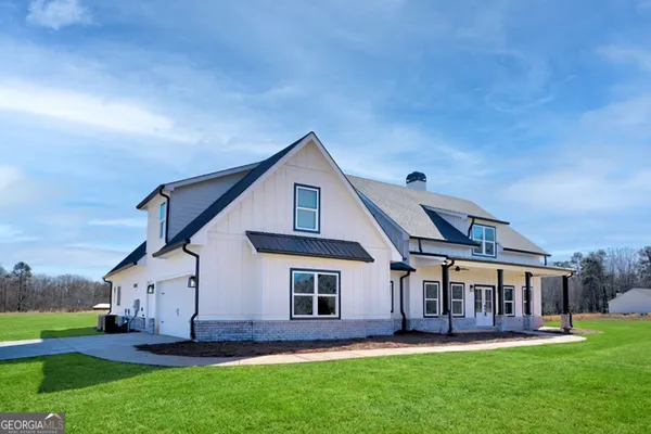front view of a house with a yard