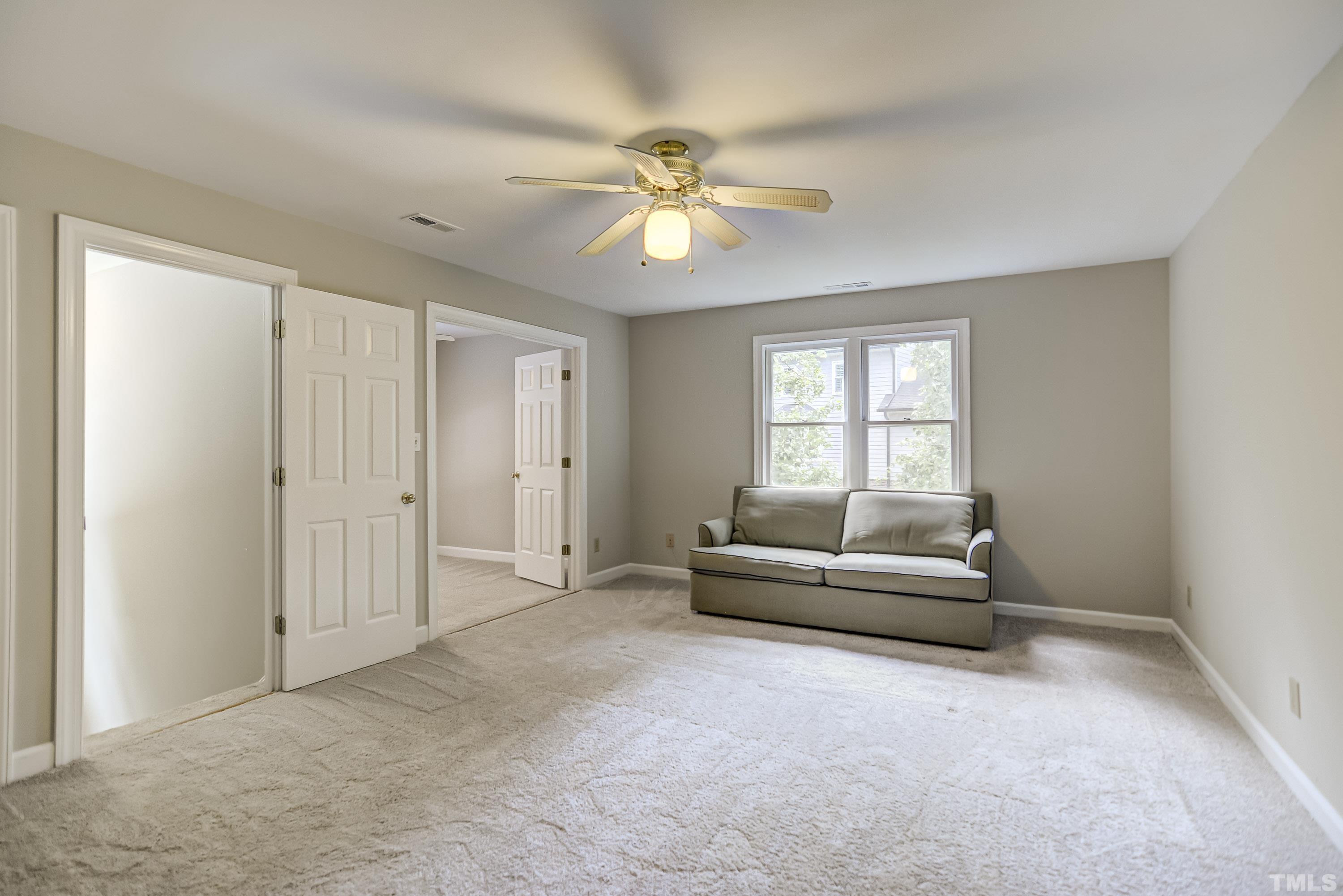 8313 Seagate Drive Raleigh, NC 27615 - Photo 20 of 24 a living room with furniture and a window