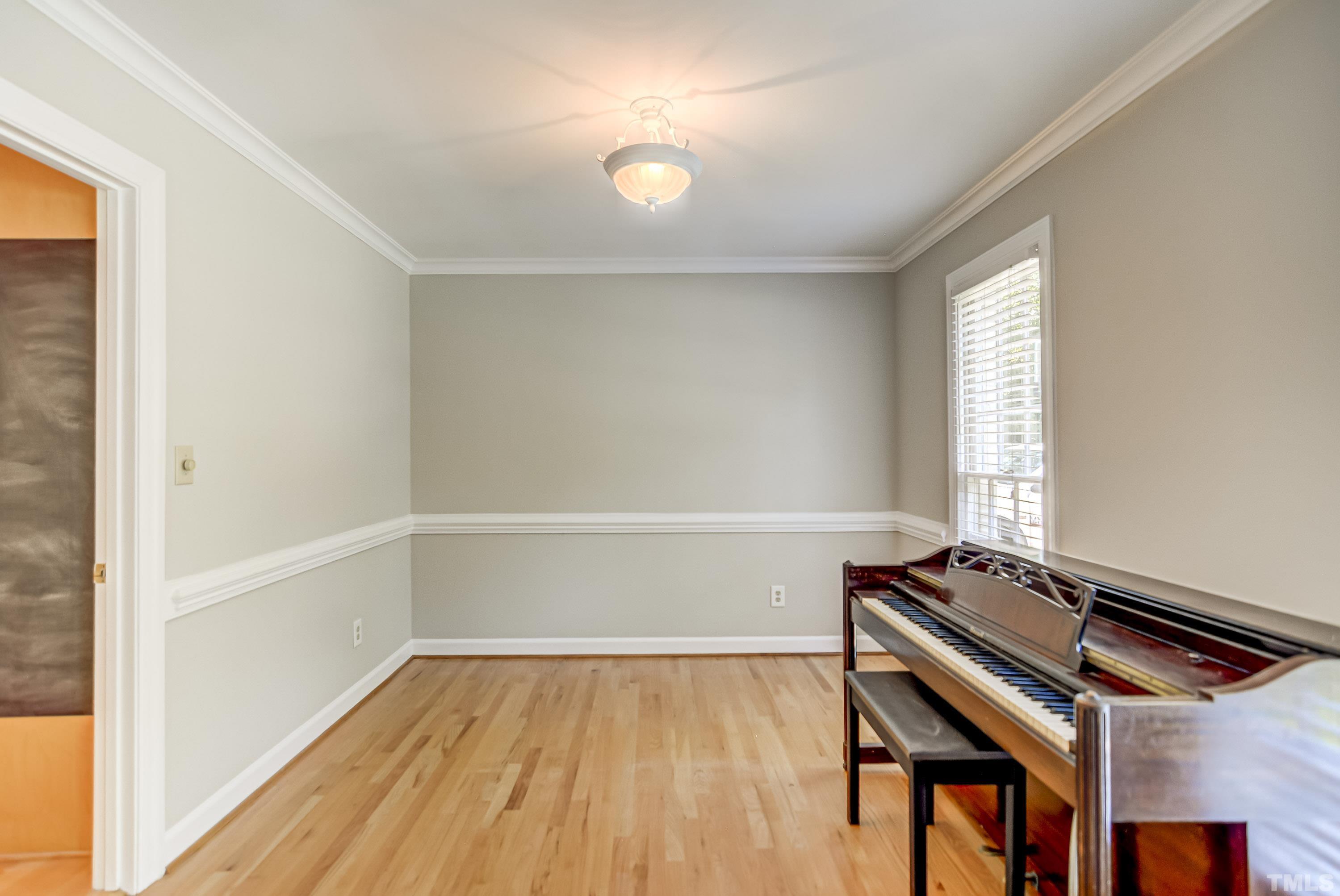 8313 Seagate Drive Raleigh, NC 27615 - Photo 4 of 24 a view of room with window and wooden floor