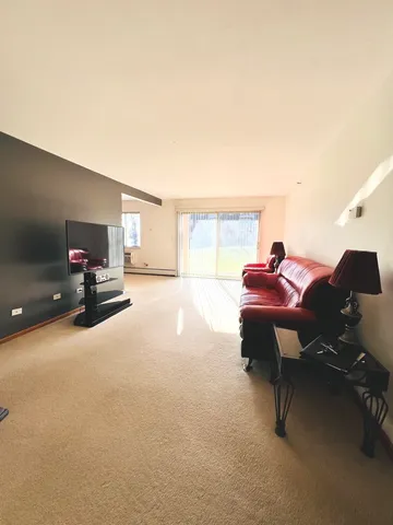 a bed room with a bed and a chair