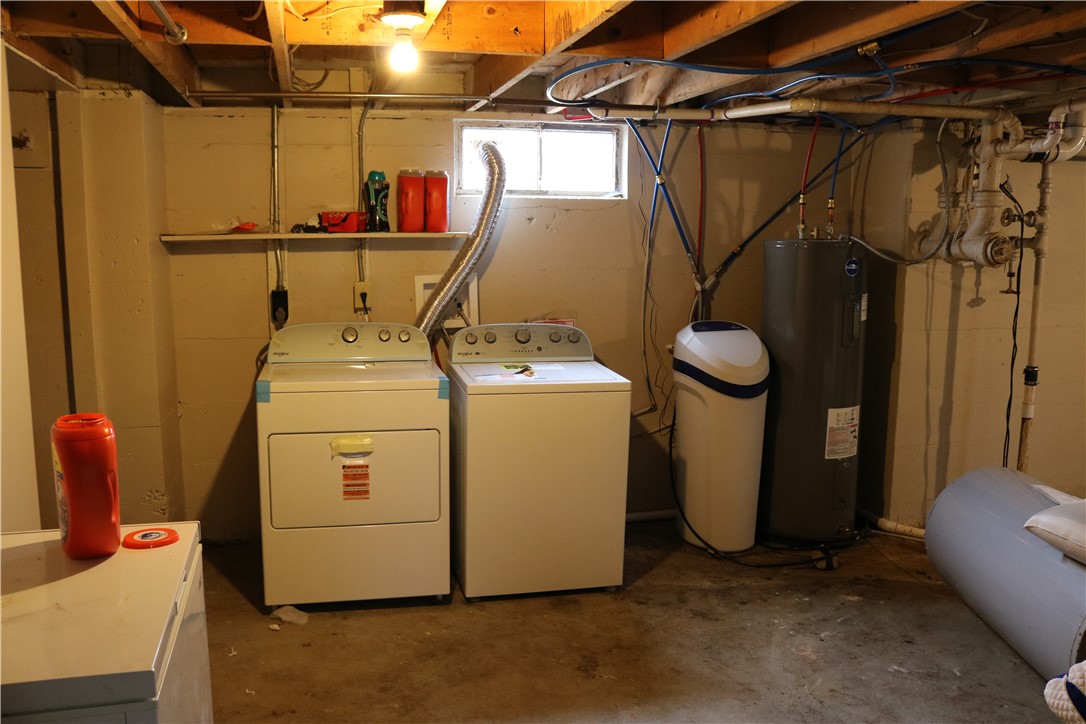 3185 Stop 8 Road Dayton, OH 45414 - Photo 6 of 10 This functional utility area features laundry facilities and essential home systems.