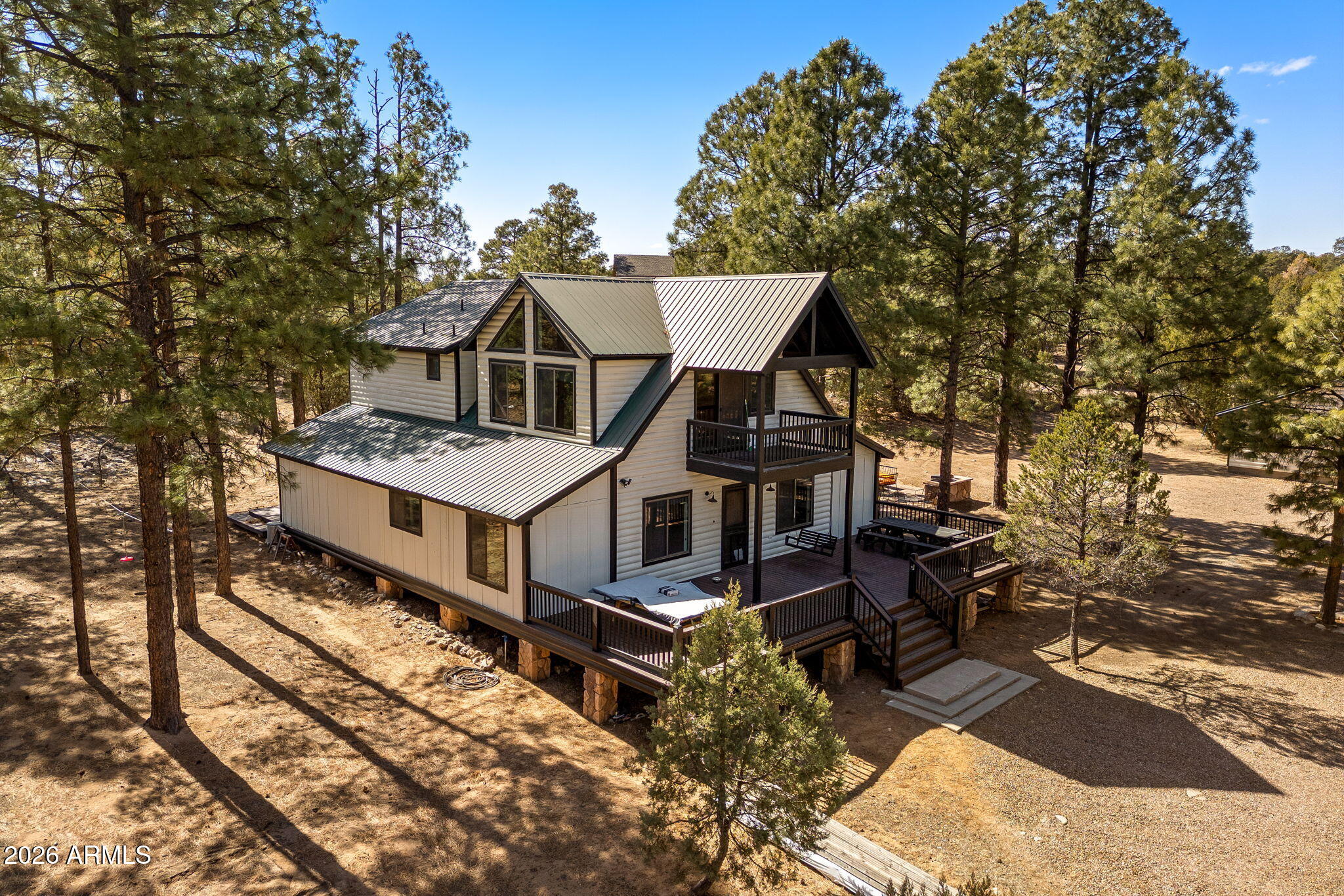 a view of a house with wooden fence