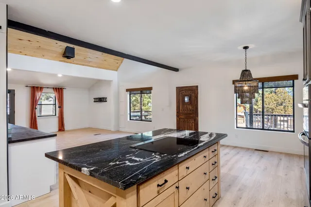 a kitchen with a stove and a sink