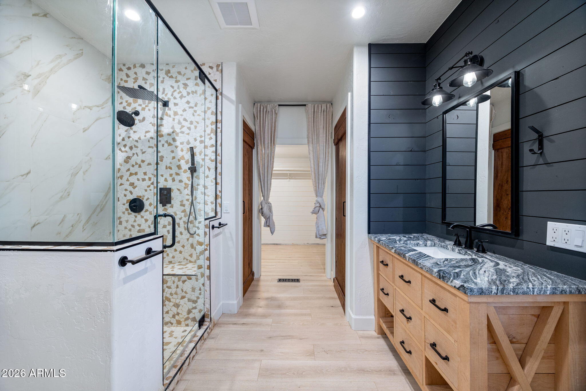 3310 Tonto Drive Overgaard, AZ 85933 - Photo 18 of 54 a bathroom with a granite countertop sink a mirror and shower