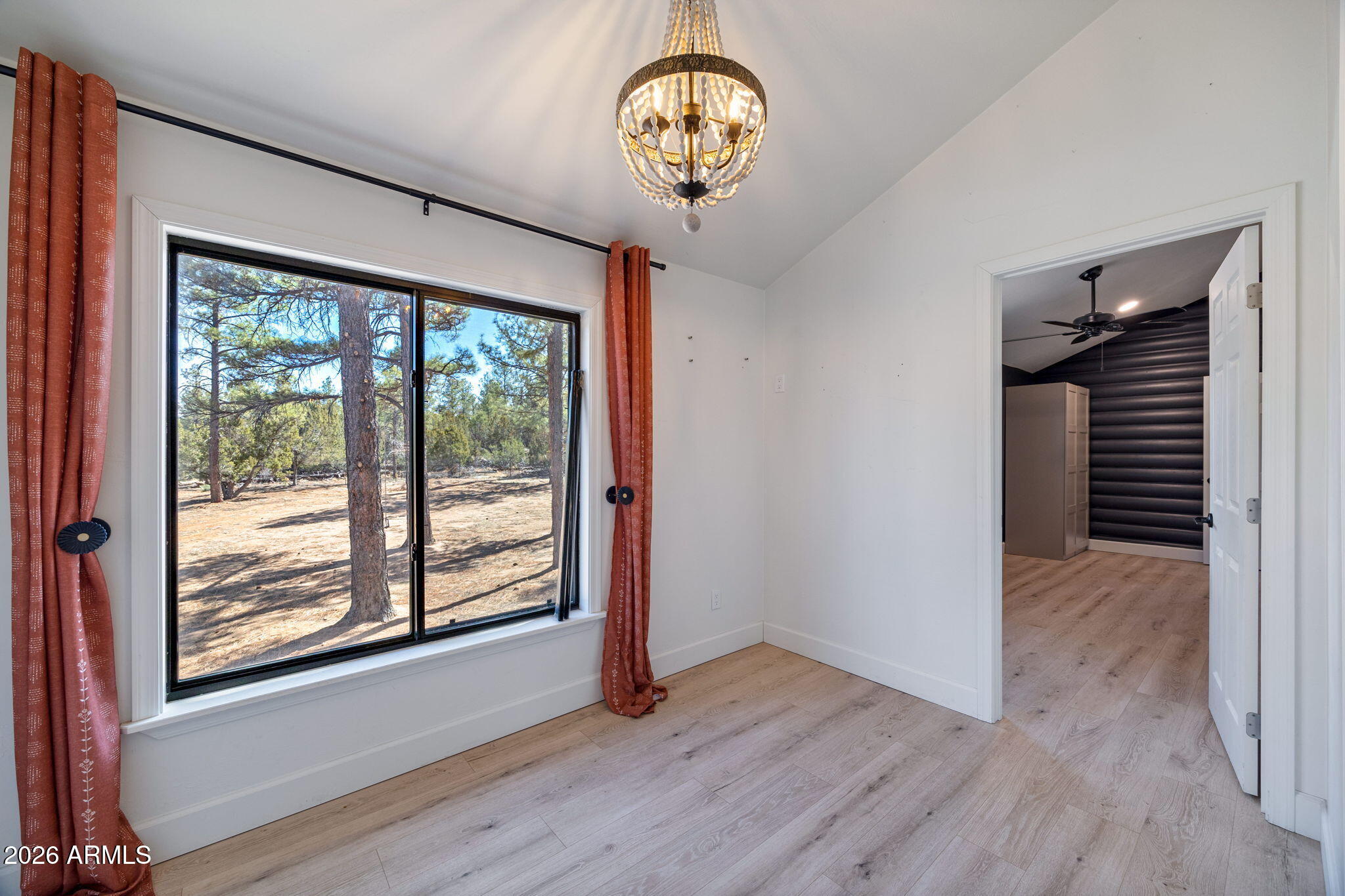 3310 Tonto Drive Overgaard, AZ 85933 - Photo 21 of 54 a view of a room with wooden floor fan and windows