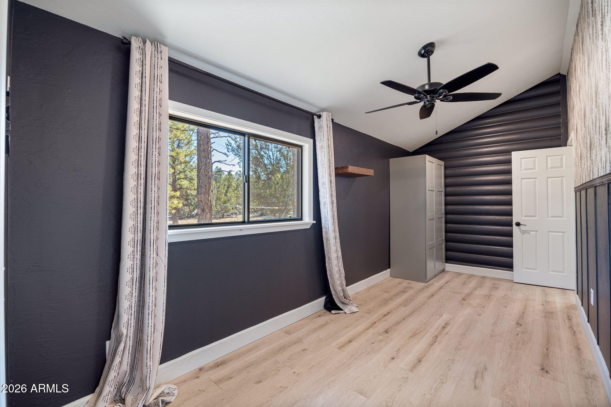 3310 Tonto Drive Overgaard, AZ 85933 - Photo 22 of 54 a view of a livingroom with a ceiling fan and window