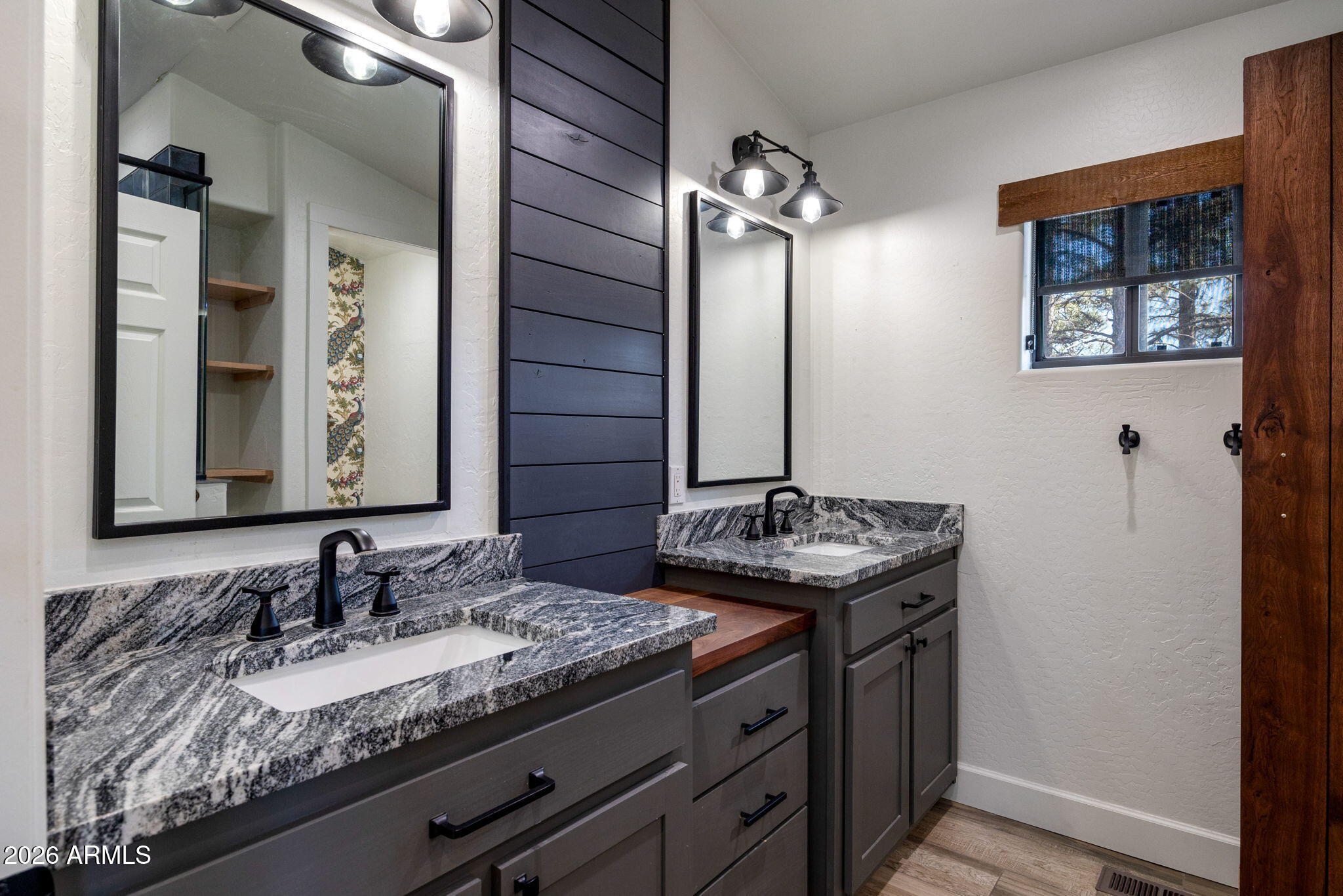 3310 Tonto Drive Overgaard, AZ 85933 - Photo 29 of 54 a bathroom with a granite countertop sink and a mirror