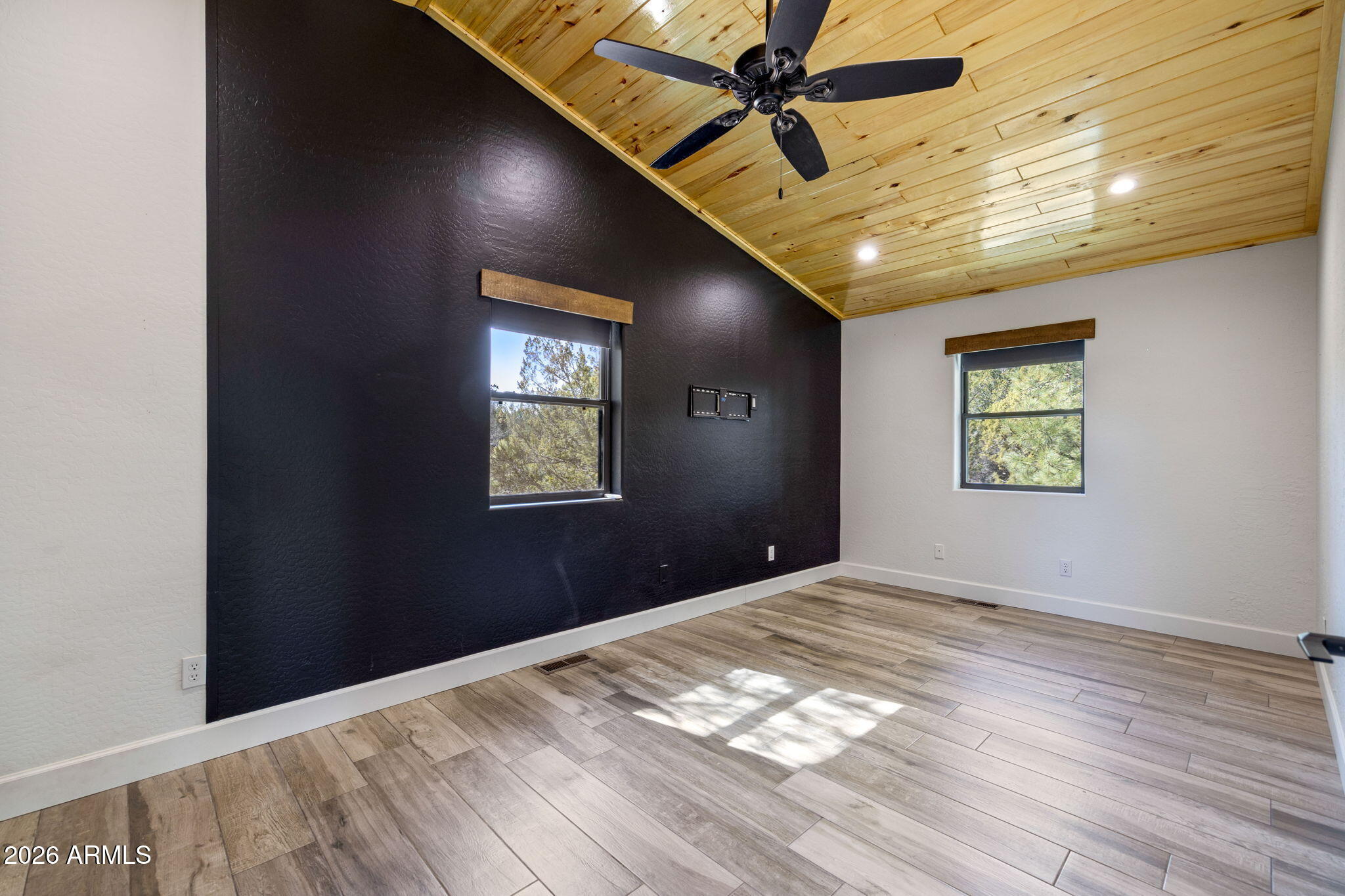 3310 Tonto Drive Overgaard, AZ 85933 - Photo 31 of 54 a view of empty room with wooden floor