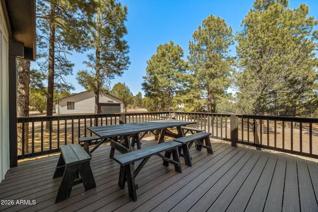 a view of balcony with wooden floor and outdoor seating