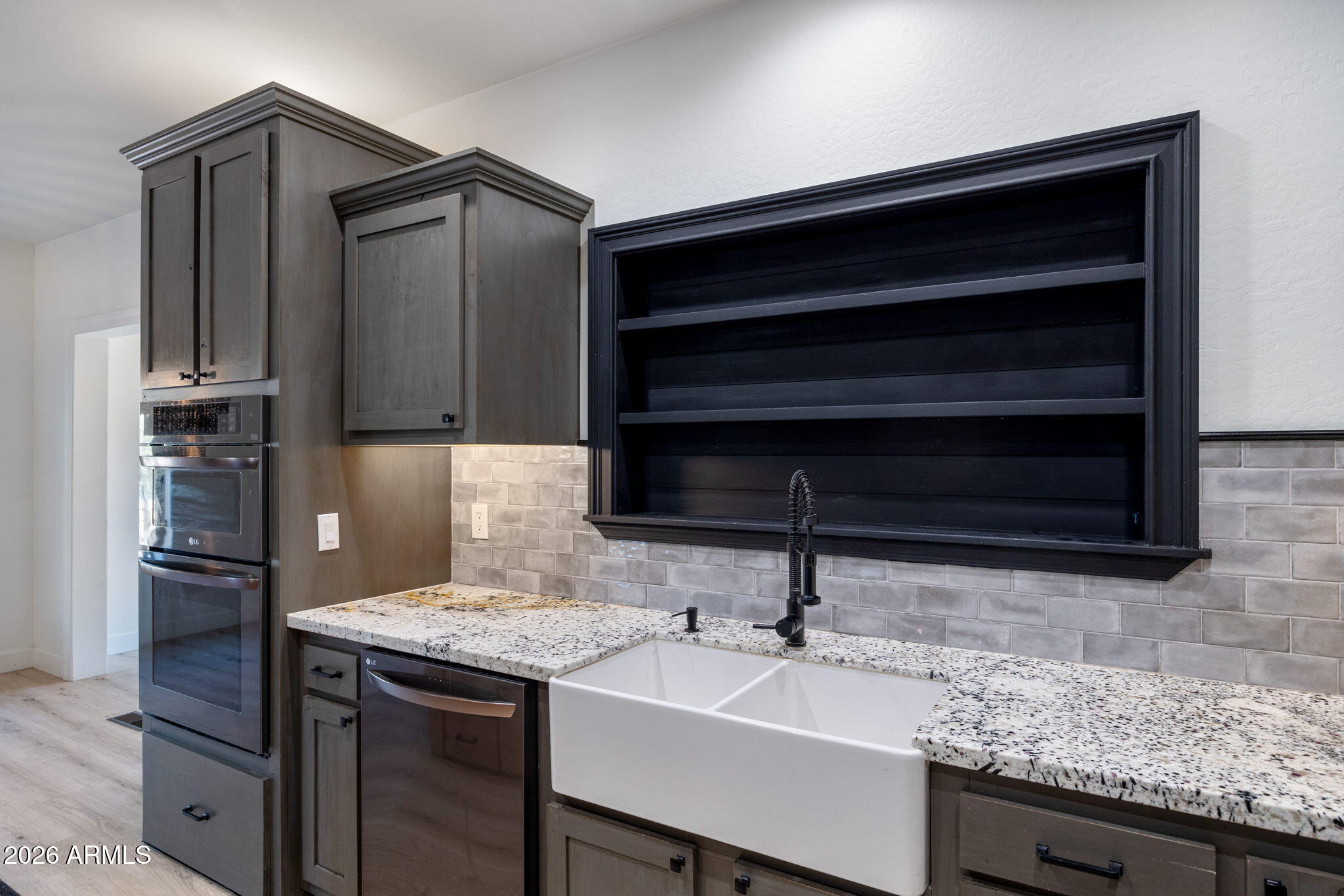 3310 Tonto Drive Overgaard, AZ 85933 - Photo 9 of 54 a kitchen with a sink and a refrigerator