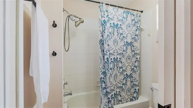 a bathroom with vanity granite a sink and a mirror