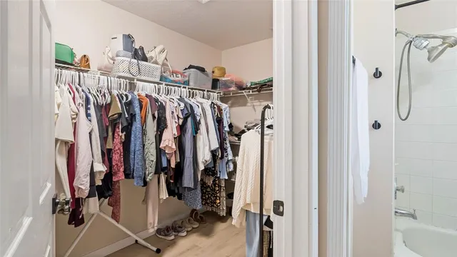 a bedroom with a bed and dresser