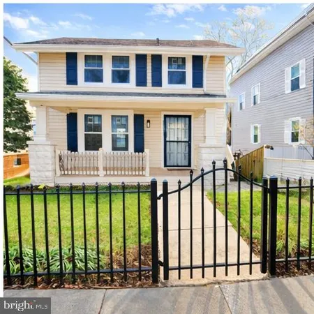 a front view of a brick house with a large windows