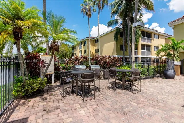 a view of an outdoor sitting area with furniture