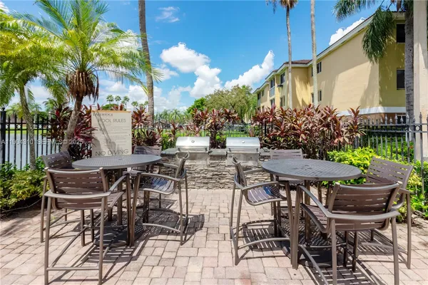 a view of deck with wooden floor and iron fence