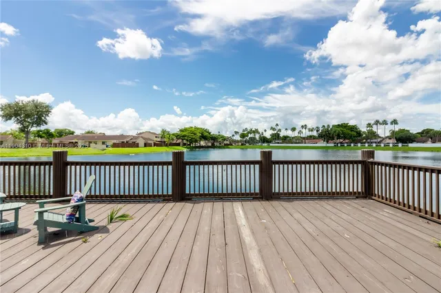 a view of a deck with chairs
