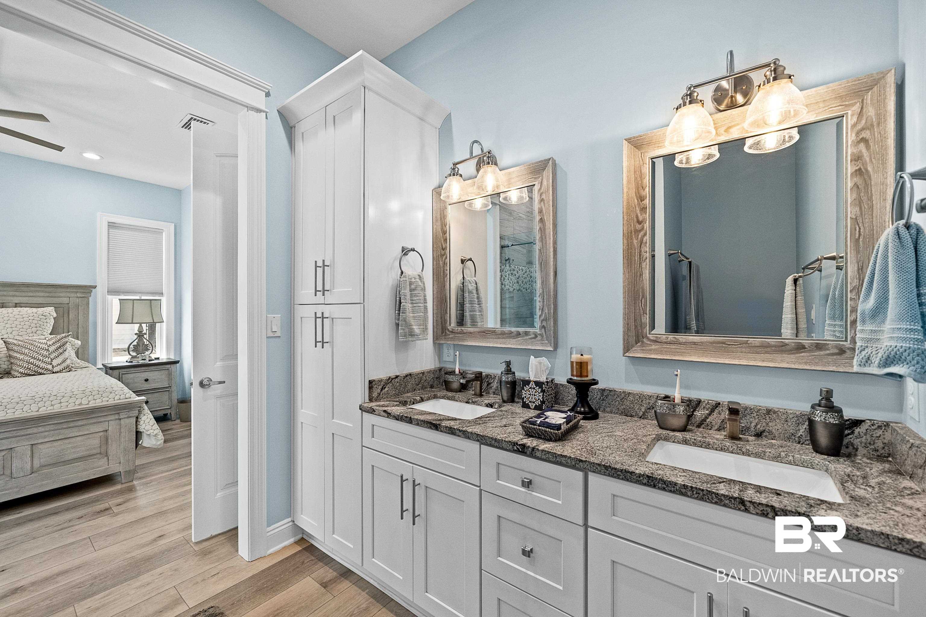 12329 Reunion Place, Unit LOT 38 Foley, AL 36535 - Photo 13 of 43 Bathroom with double vanity, ensuite bathroom, and light wood-type flooring