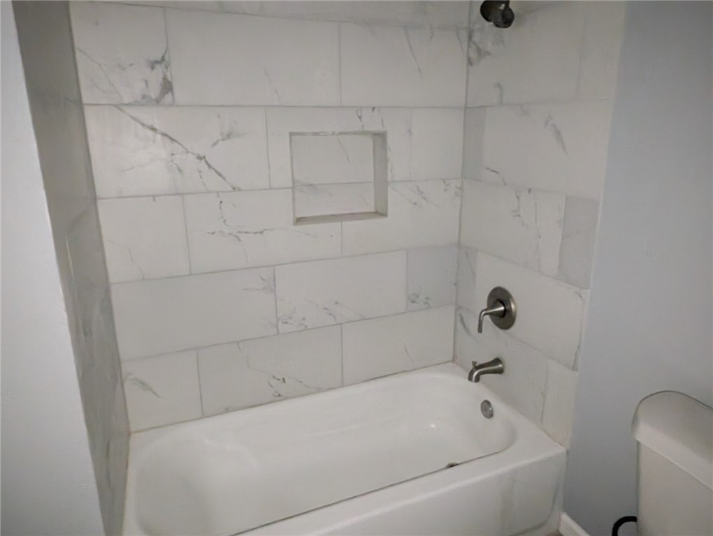 4709 Archer Drive Corpus Christi, TX 78415 - Photo 12 of 17 a bathroom with a bathtub