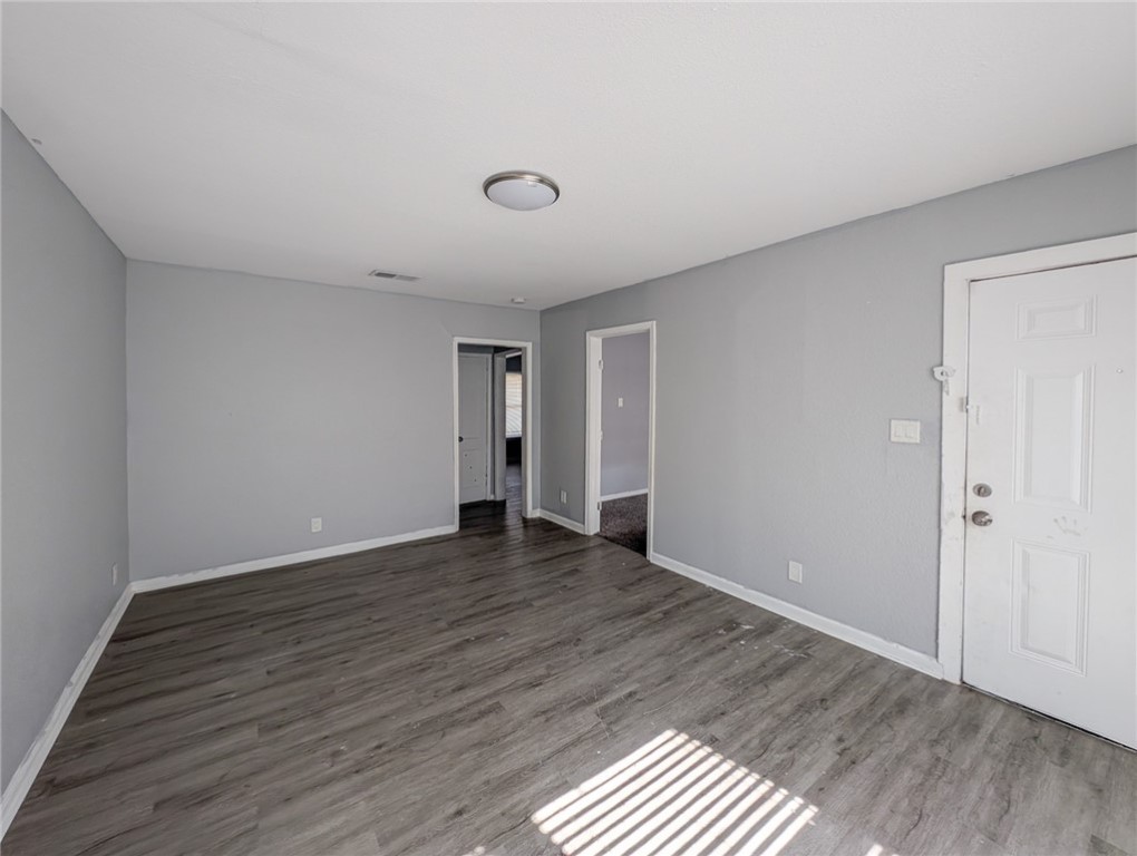4709 Archer Drive Corpus Christi, TX 78415 - Photo 3 of 17 a view of an empty room with wooden floor