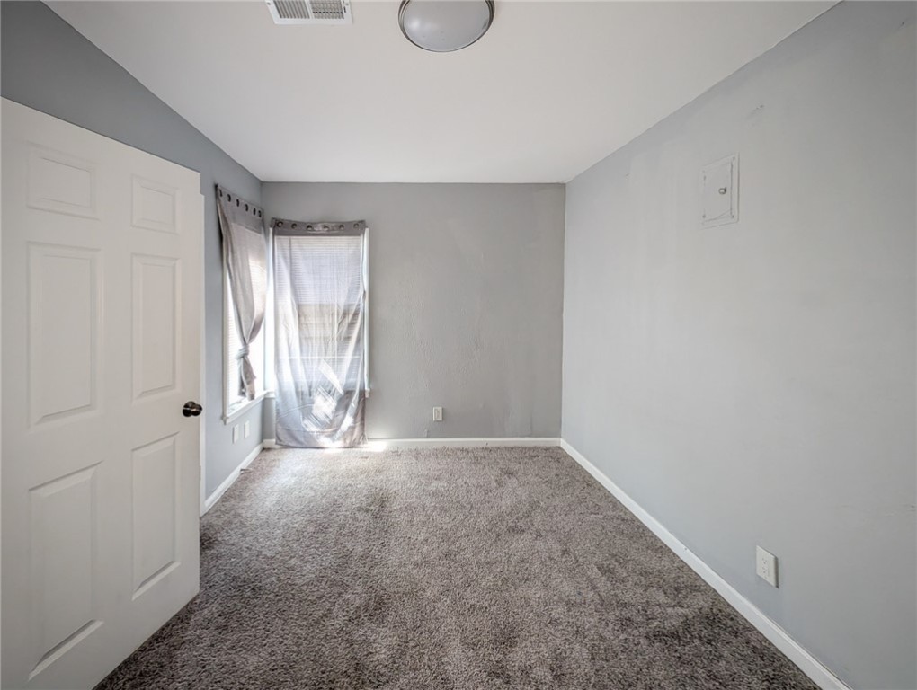 4709 Archer Drive Corpus Christi, TX 78415 - Photo 10 of 17 a view of an empty room with window and closet area