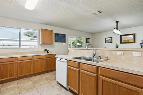 a kitchen with a sink and cabinets