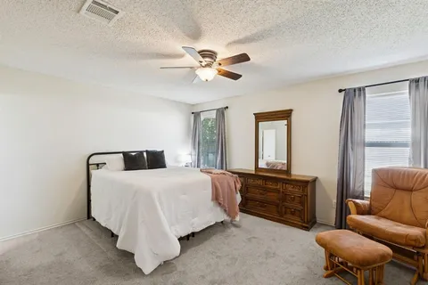 a bedroom with a bed furniture and a window