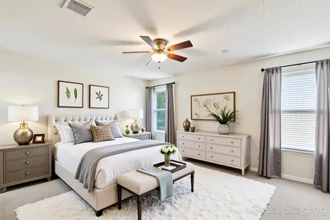 a bedroom with a bed and a dresser