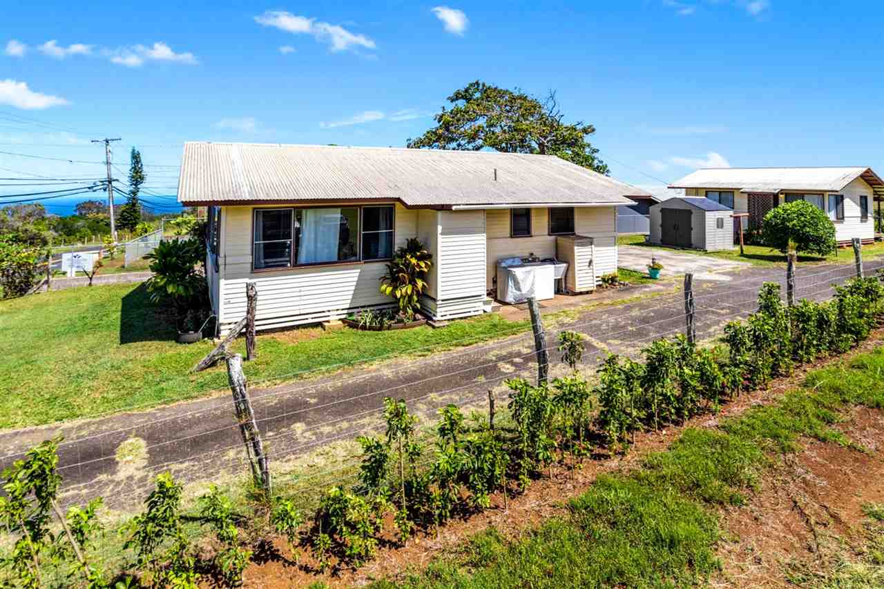2229 Kaupakalua Road Haiku, HI 96708 - Photo 1 of 29 a front view of a house with garden