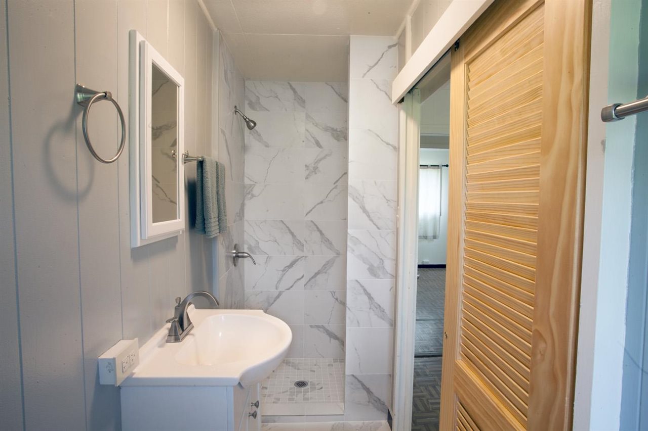 2229 Kaupakalua Road Haiku, HI 96708 - Photo 8 of 29 a bathroom with a sink shower and a mirror