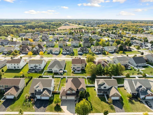 an aerial view of residential houses with outdoor space