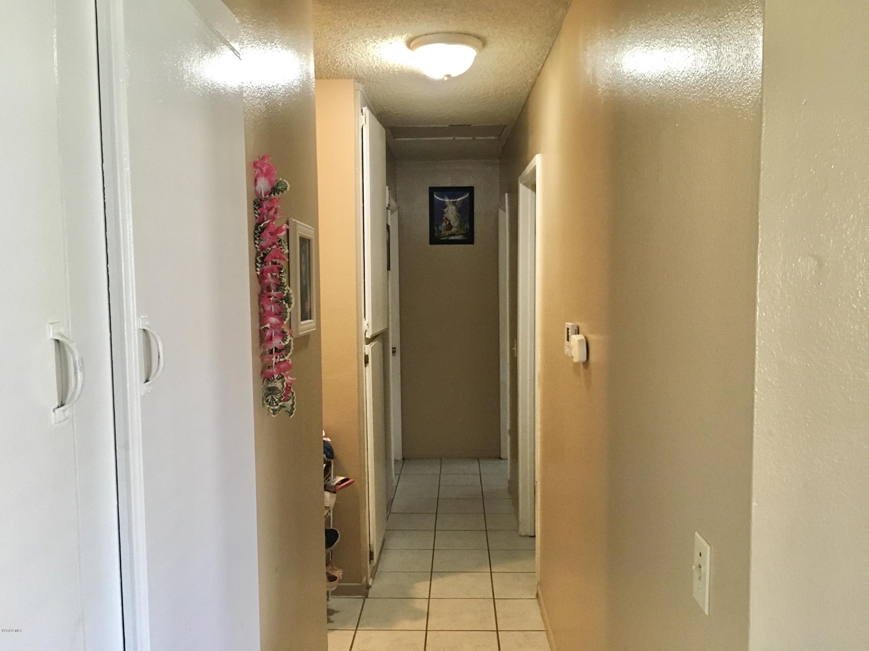 520 Spring Road, Unit 109 Moorpark, CA 93021 - Photo 3 of 8 a bathroom with a mirror