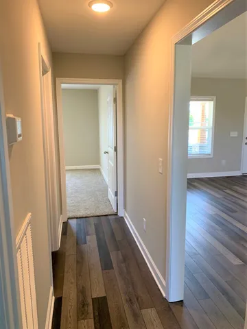 an empty room with a fan and a fan