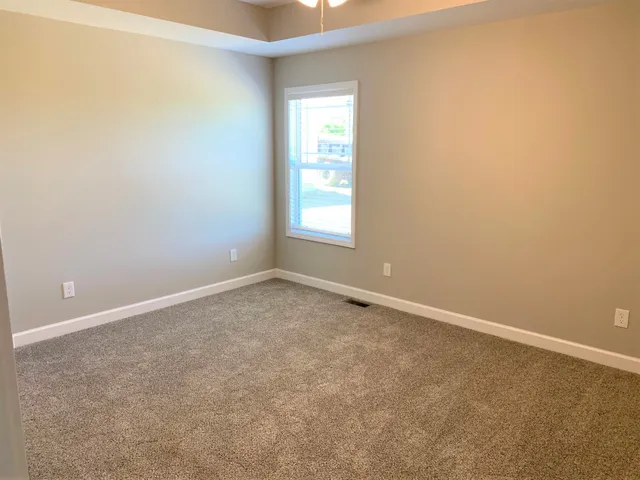 a bathroom with two sink and a mirror
