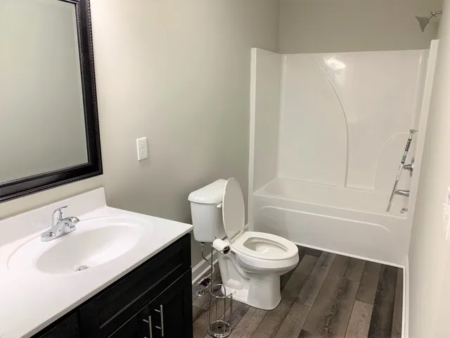 a bathroom with 2 sink and a mirror