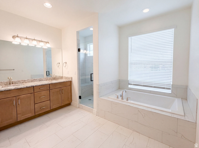 1251 North 2525 West Clinton, UT 84015 - Photo 6 of 30 Spacious bathroom featuring a built-in soaking tub, a clear glass shower enclosure, a double vanity with light-toned cabinetry, and extensive tile flooring