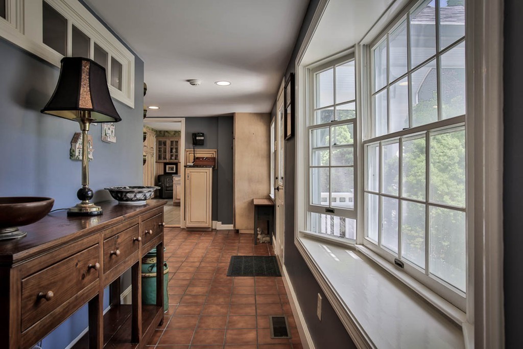 1129 Walnut Plain Road Rochester, MA 02770 - Photo 11 of 29 a kitchen with stainless steel appliances a stove and a refrigerator