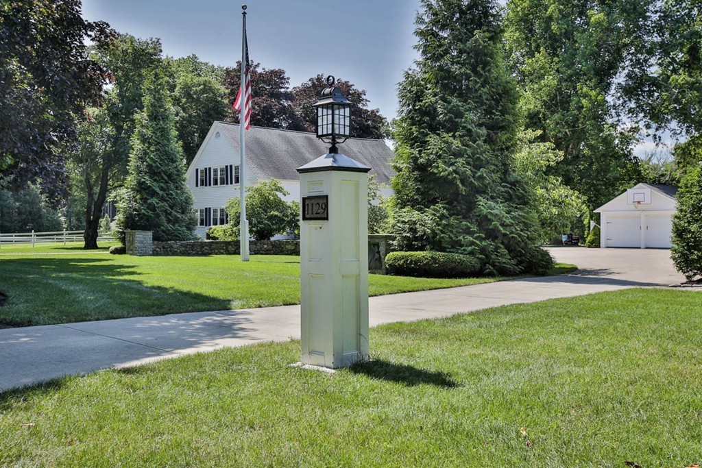 1129 Walnut Plain Road Rochester, MA 02770 - Photo 21 of 29 a front view of a house with a yard