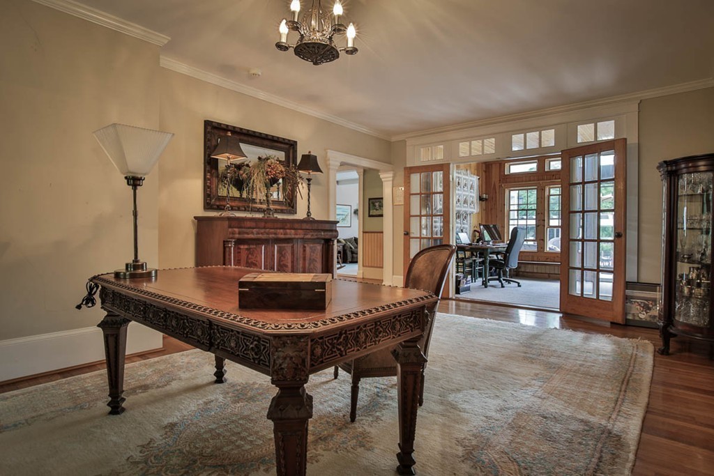1129 Walnut Plain Road Rochester, MA 02770 - Photo 3 of 29 a dining room with furniture a chandelier and wooden floor