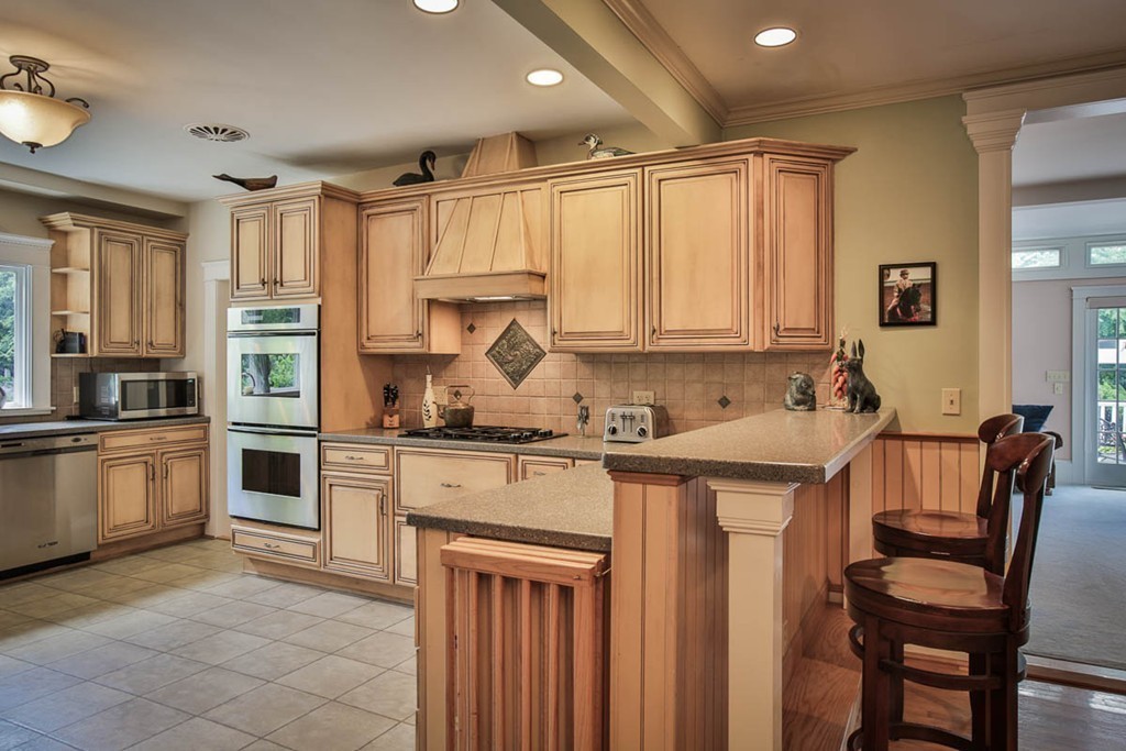 1129 Walnut Plain Road Rochester, MA 02770 - Photo 4 of 29 a kitchen with stainless steel appliances granite countertop a stove refrigerator and cabinets
