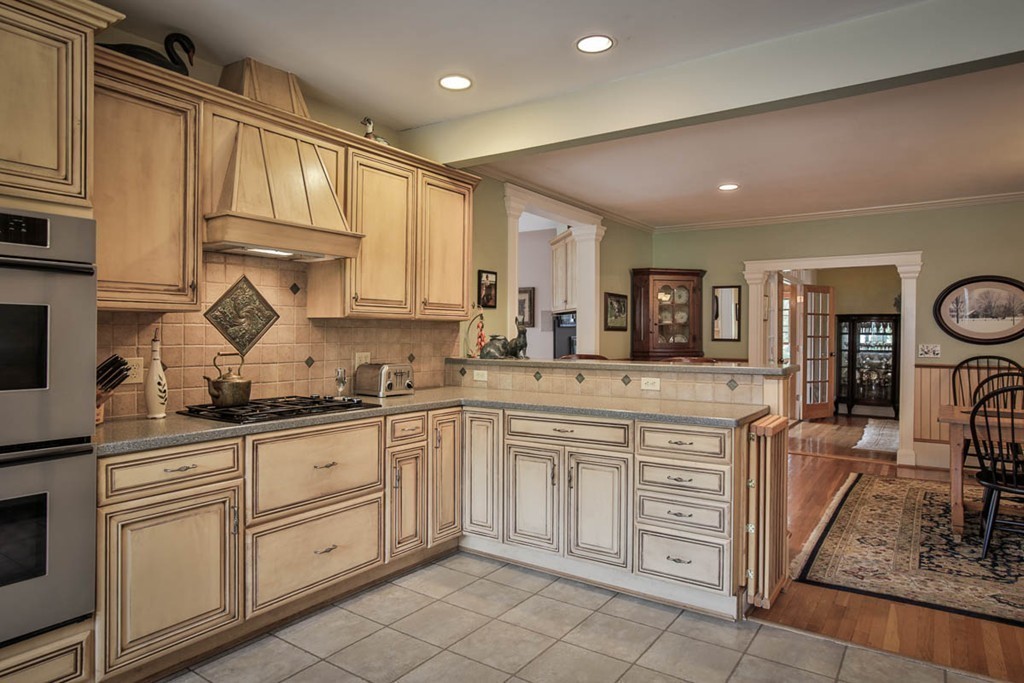 1129 Walnut Plain Road Rochester, MA 02770 - Photo 5 of 29 a kitchen with cabinets appliances a sink and a counter top space