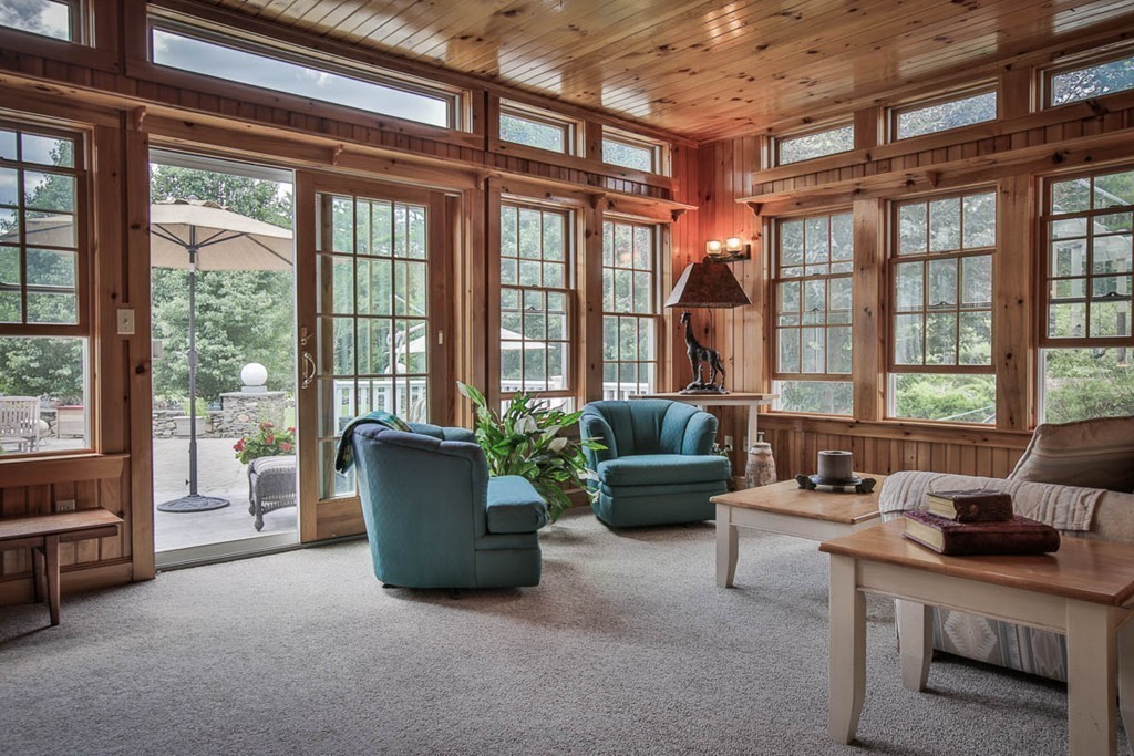 1129 Walnut Plain Road Rochester, MA 02770 - Photo 8 of 29 a living room with furniture and a floor to ceiling window