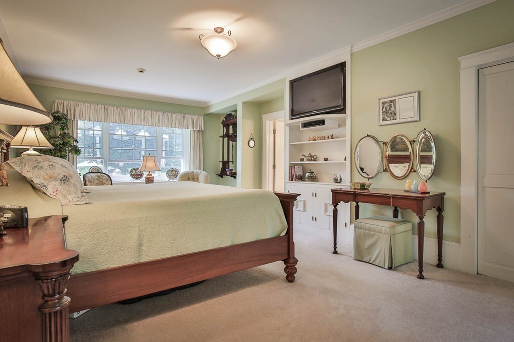 1129 Walnut Plain Road Rochester, MA 02770 - Photo 9 of 29 a bed room with a bed and a television