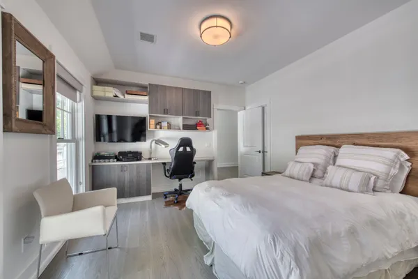 a bedroom with a bed furniture and a window