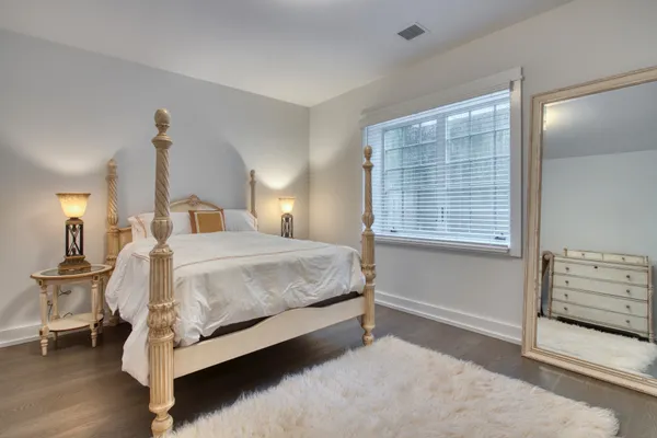 a bed room with a bed and a window