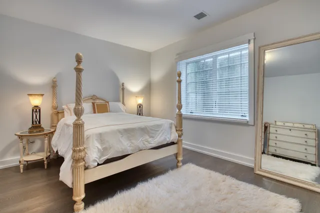 a bed room with a bed and a window