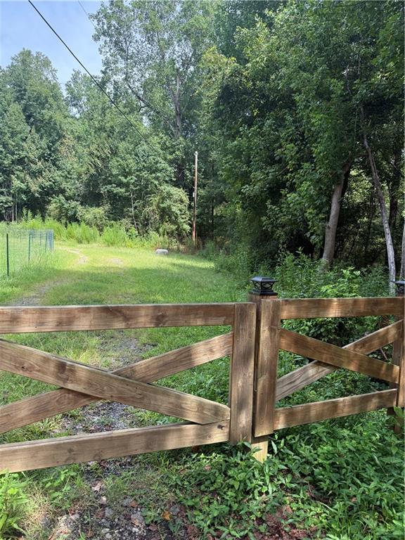 2923 Raintree Drive Southeast Conyers, GA 30094 - Photo 2 of 3 a view of a park next to a yard