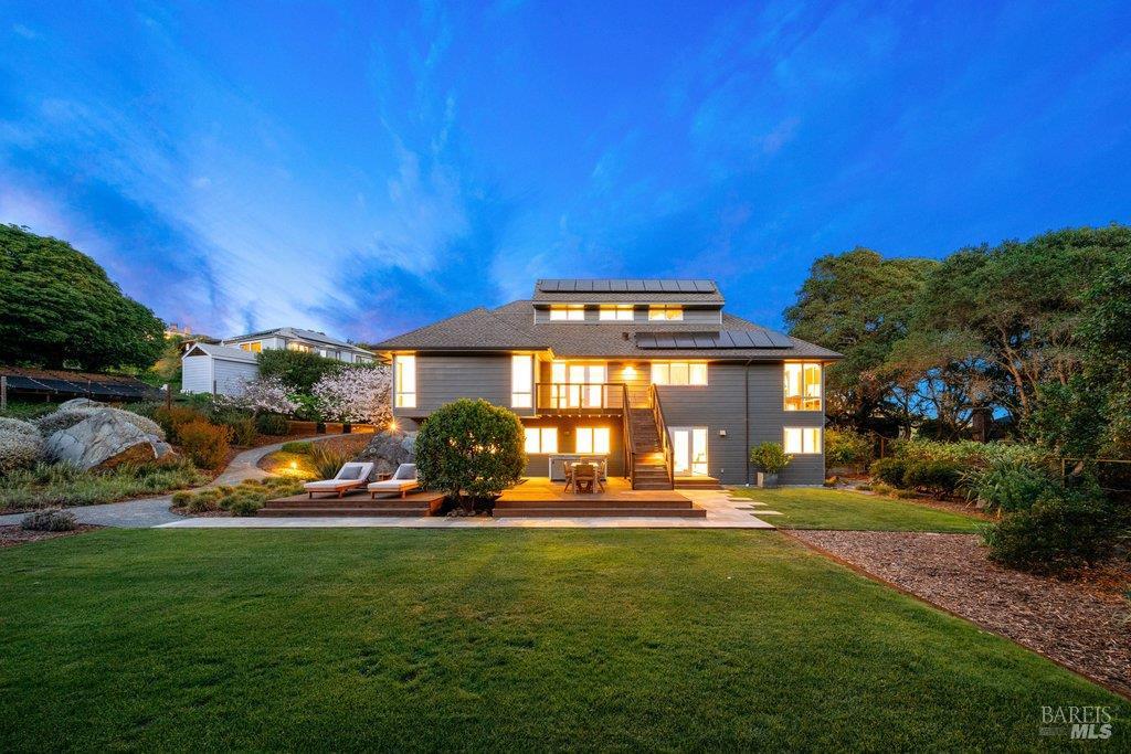 a view of a house with a big yard
