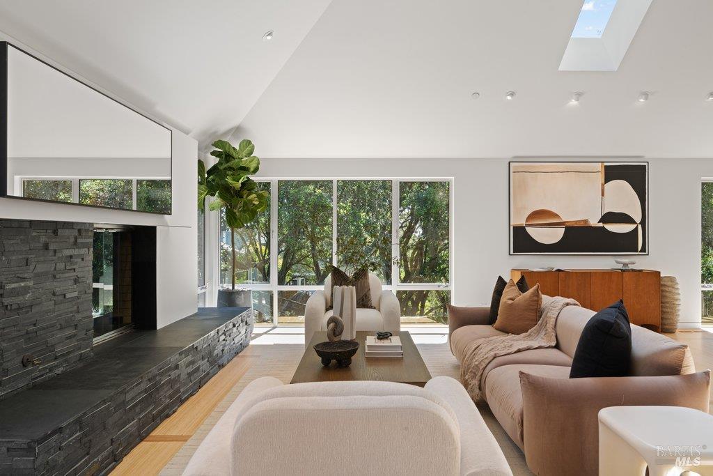 103 Reed Ranch Road Tiburon, CA 94920 - Photo 11 of 89 a living room with furniture and a fireplace
